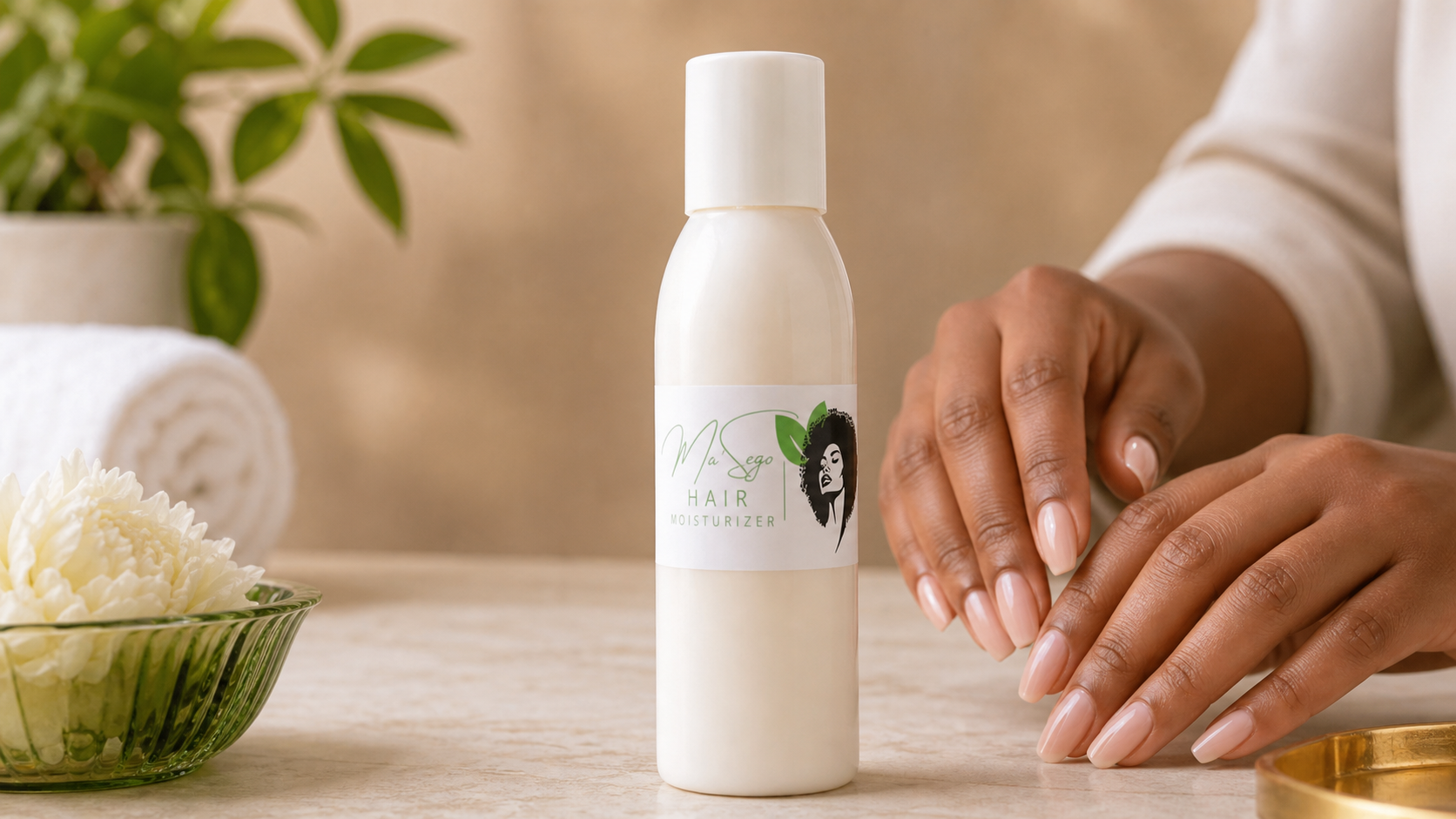 Mosadi Ke Bontle hair moisturizer bottle beside manicured hands